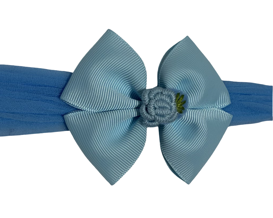 Blue headband with a large bow on a white background