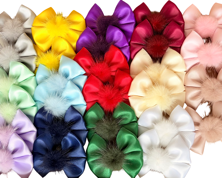 Assorted colorful hair bows on a white background