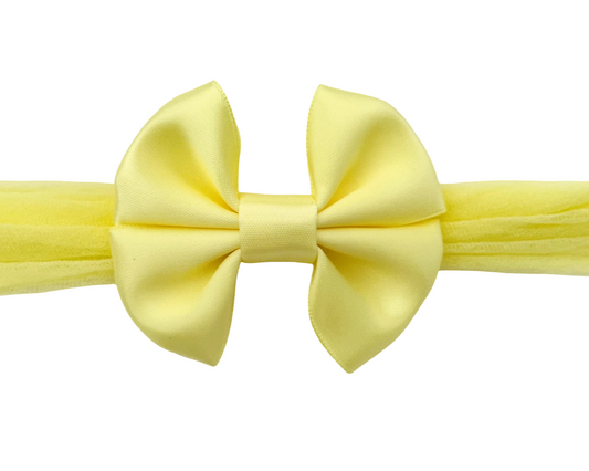 Yellow bow tie on a white background