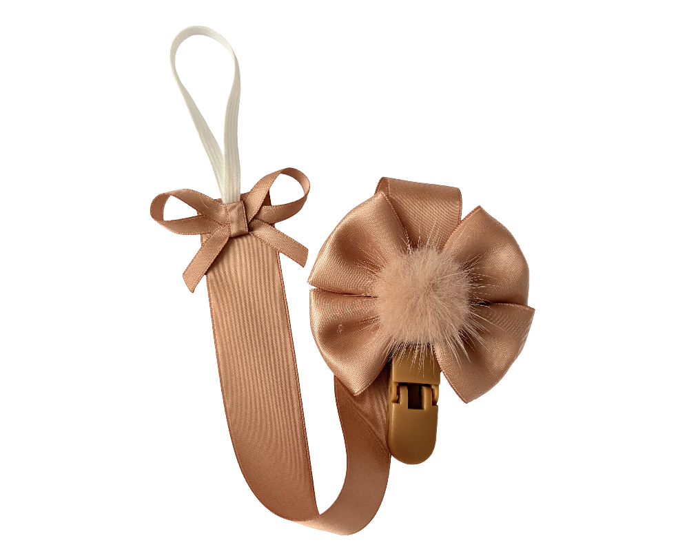 Brown hair clip with bow and fluffy center on a white background
