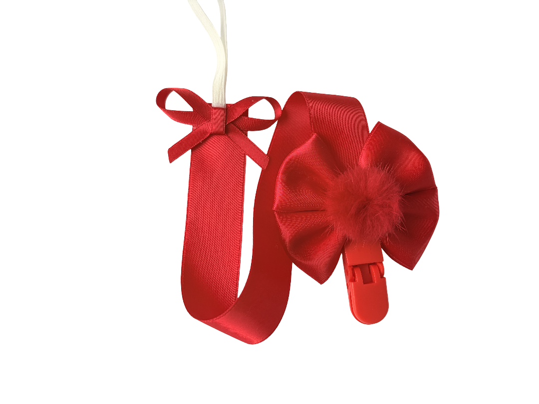 Red ribbon with a decorative bow on a white background