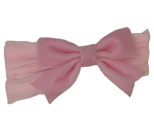 A light pink bow with a matching pink pleated fabric headband, shown against a plain white background.