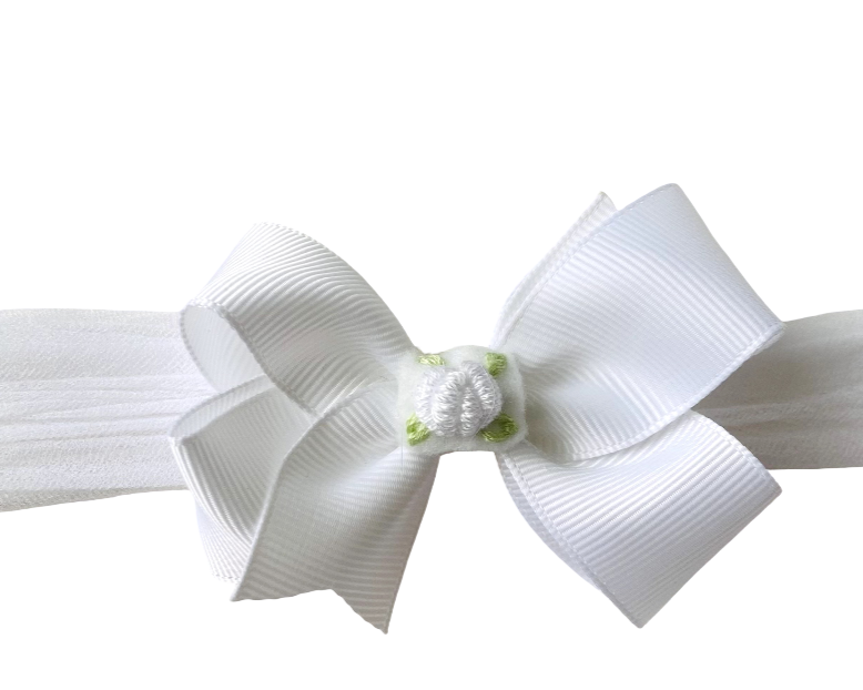 White headband with a large bow on a white background