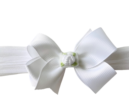 White headband with a large bow on a white background