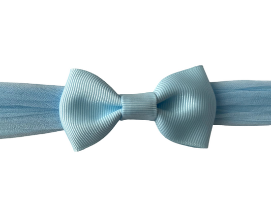 Light blue bow tie on a white background
