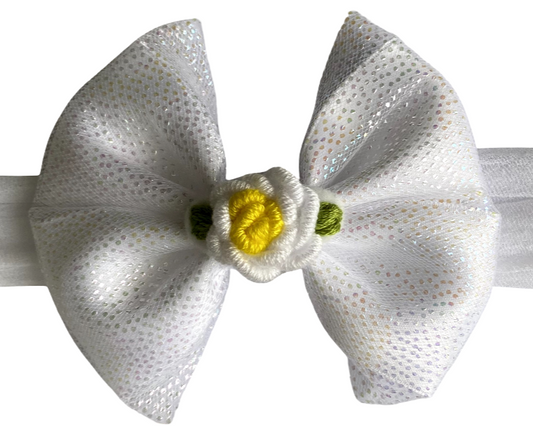 White bow headband with a small yellow flower on a white background