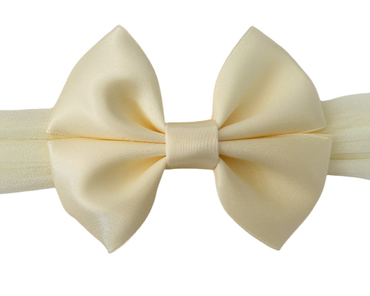Cream-colored bow tie on a white background
