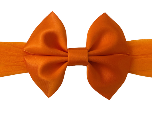 Orange bow tie on a white background