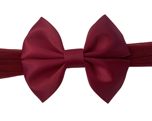 Maroon bow tie on a white background