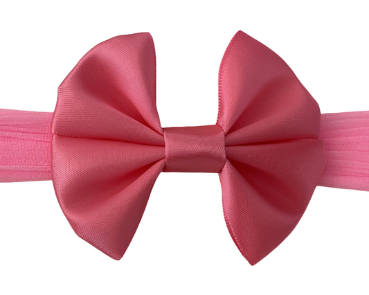 Pink bow with a white background
