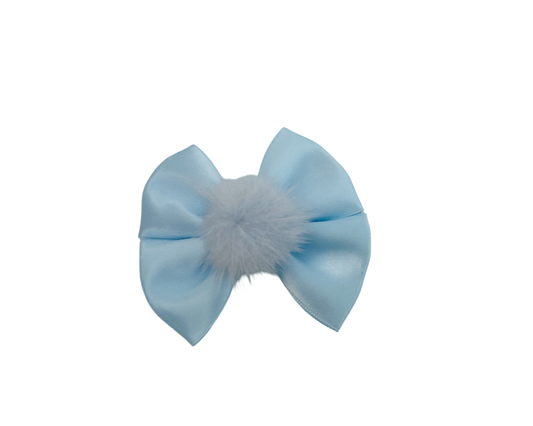 Light blue bow with a fluffy gray center on a white background