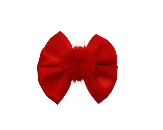 Red bow with feather details on a white background