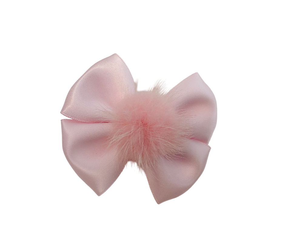 Pink bow with feathers on a white background