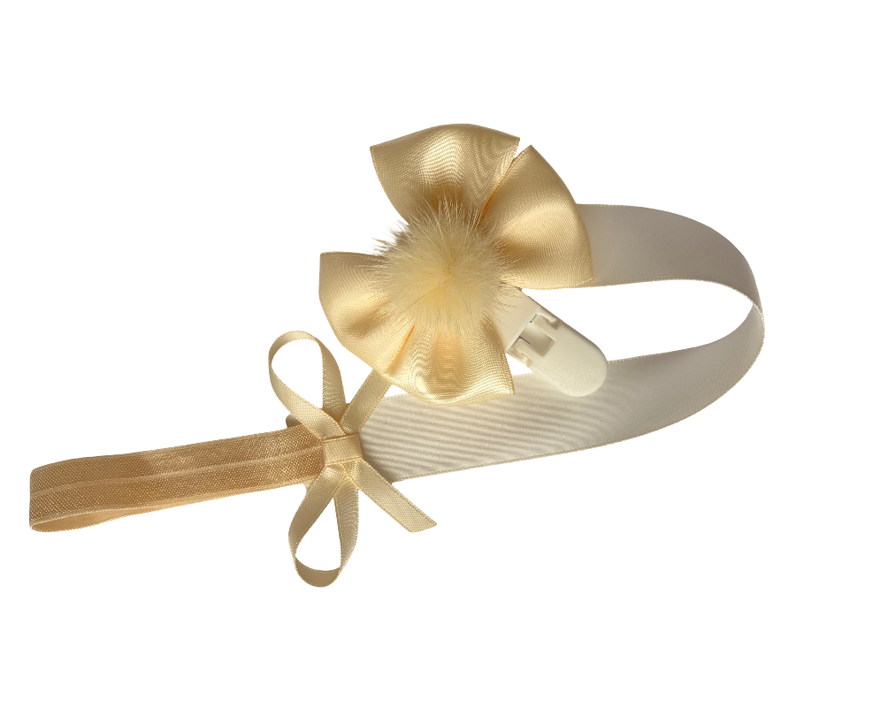 Gold bow with ribbons on a white background