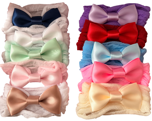 Set of colorful bow hair accessories on a white background